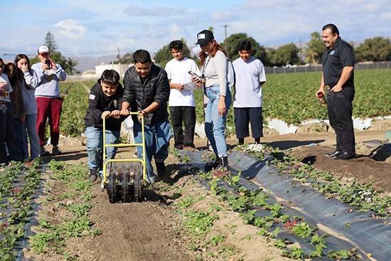 Rio School District middle school students prepare garden for planting.