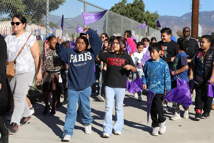 Students, parents and teachers participated in a walk around the school day.