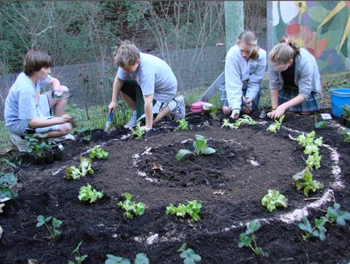 San Domenico (Green Ribbon Schools) - Students completing a math lesson while planting in the school garden.